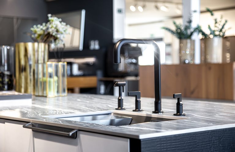 Black faucet with a steel sink in a stylish modern kitchen. | Lisa's ...