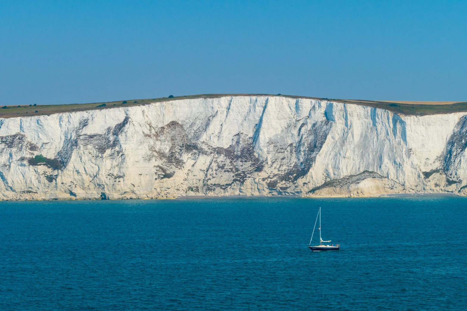 Sailboat in Front of White Cliffs of Dover