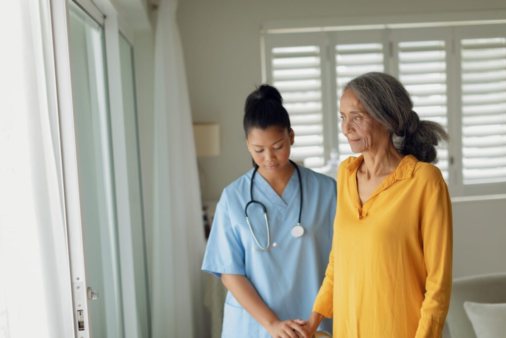 Healthcare worker and old woman