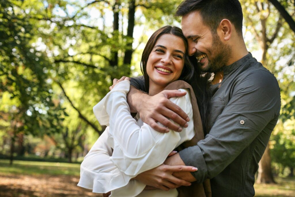 Young couple having fun in park