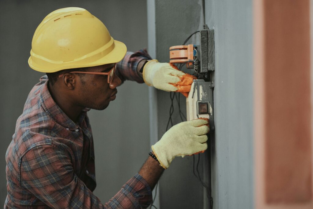 Man wearing yellow hard hat working