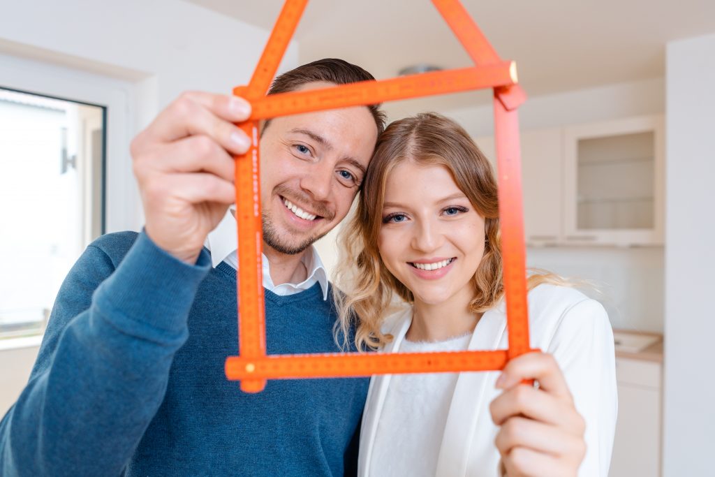Woman and man having had success in finding a new apartment wanting to move in