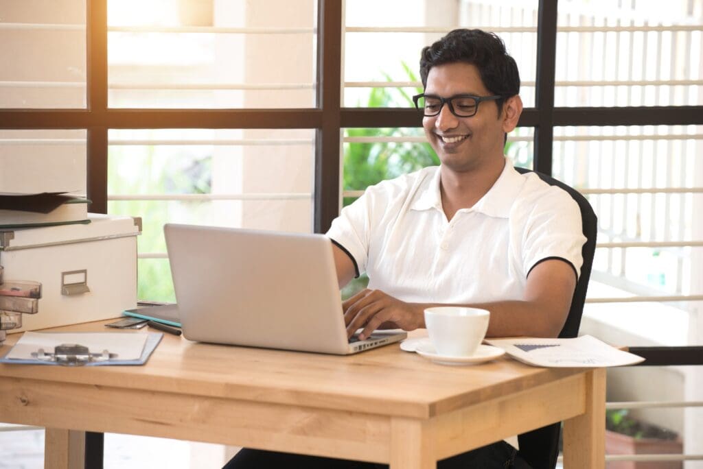 young indian man working from home office