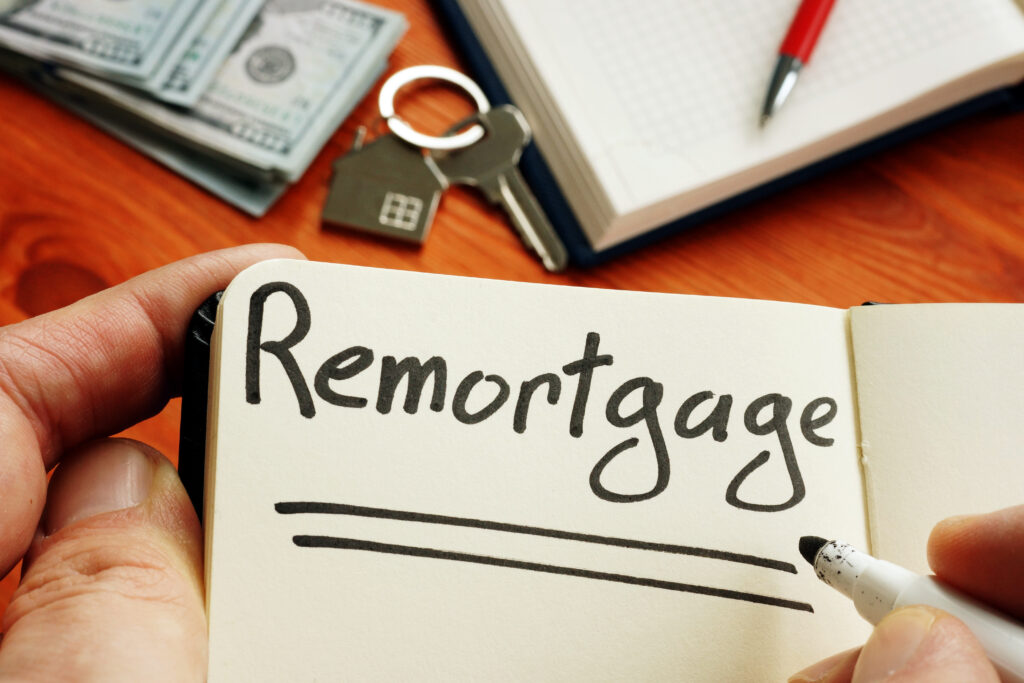 Remortgage handwritten word by man