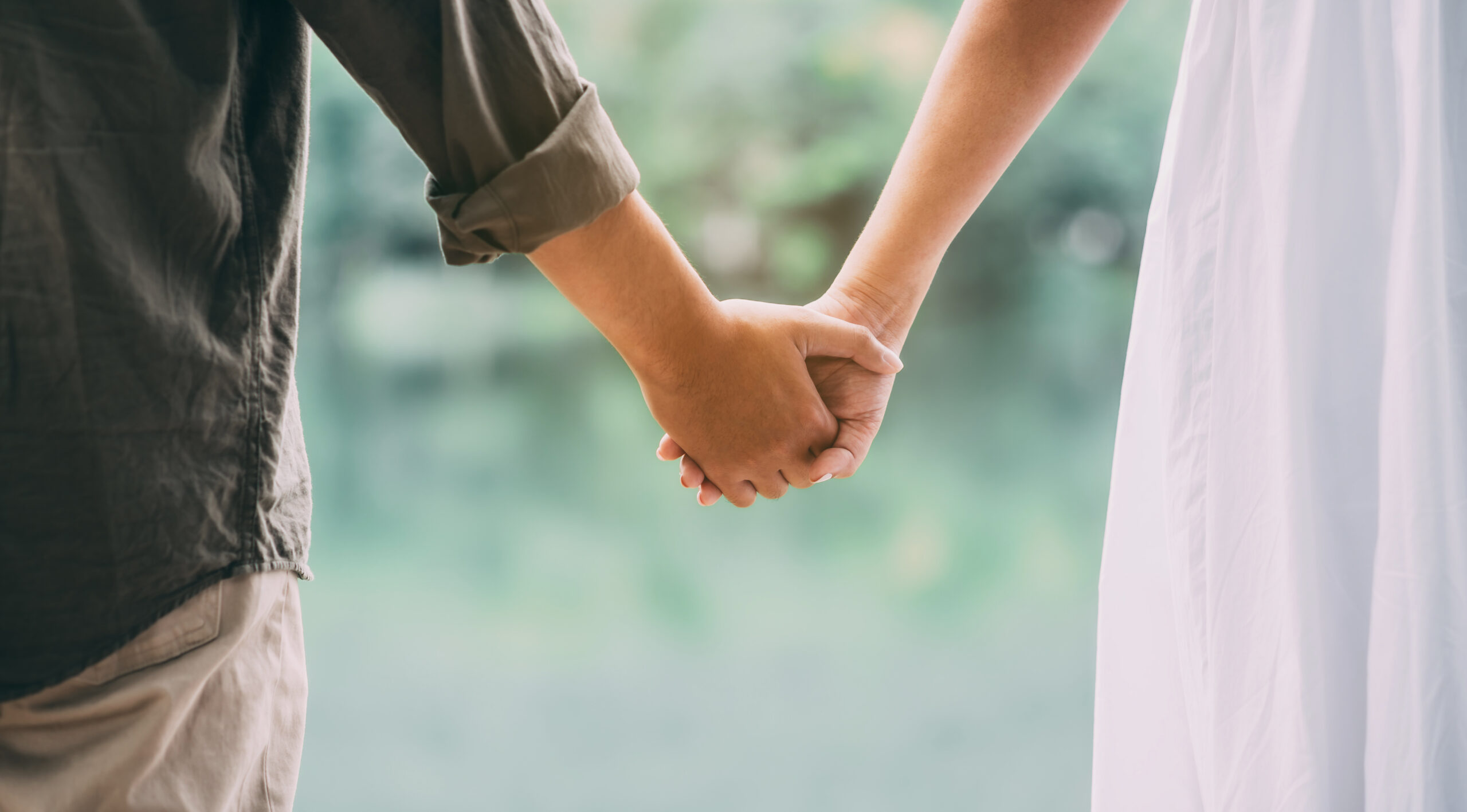 Young couple holding hands