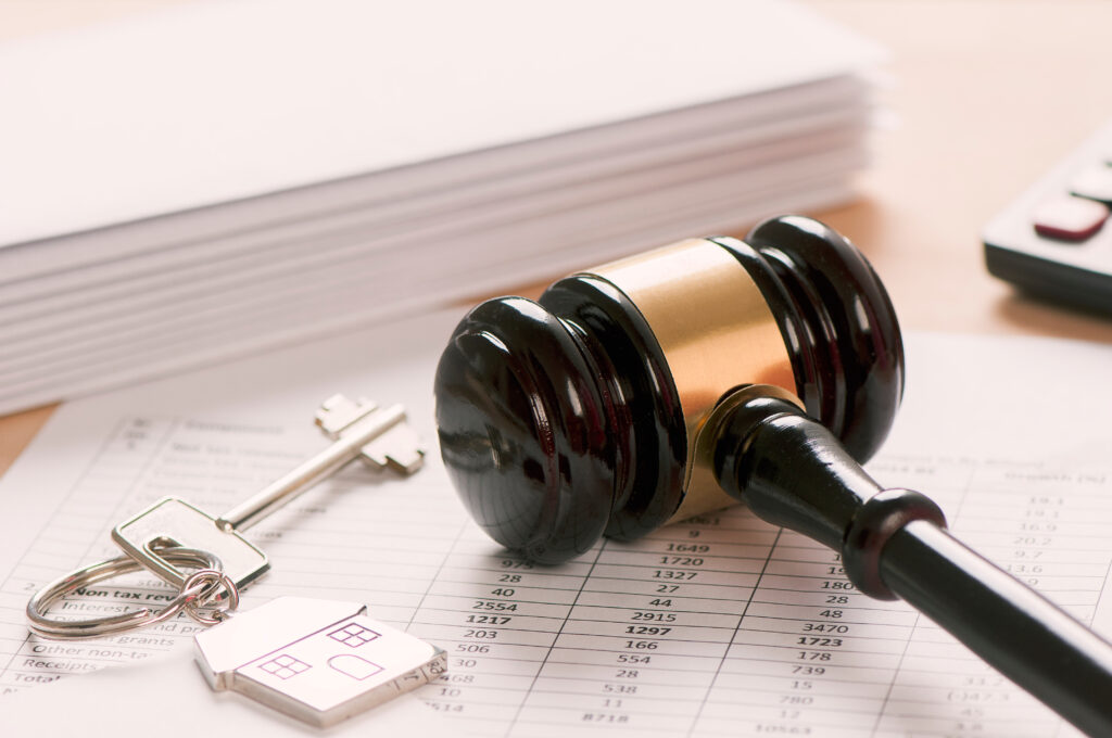 Picture of house keys next to gavel