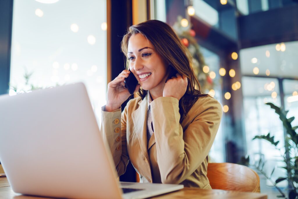 pleased woman on laptop
