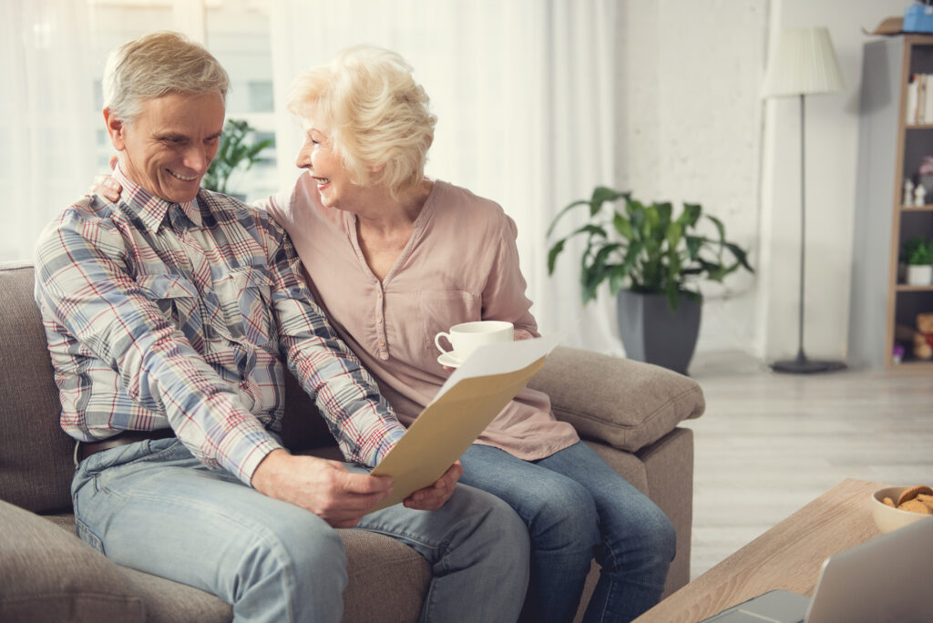 Mature married people admiring written testament