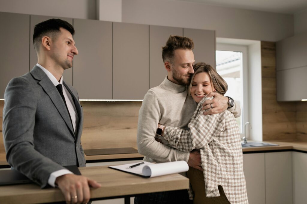 Couple hugging each other in new house
