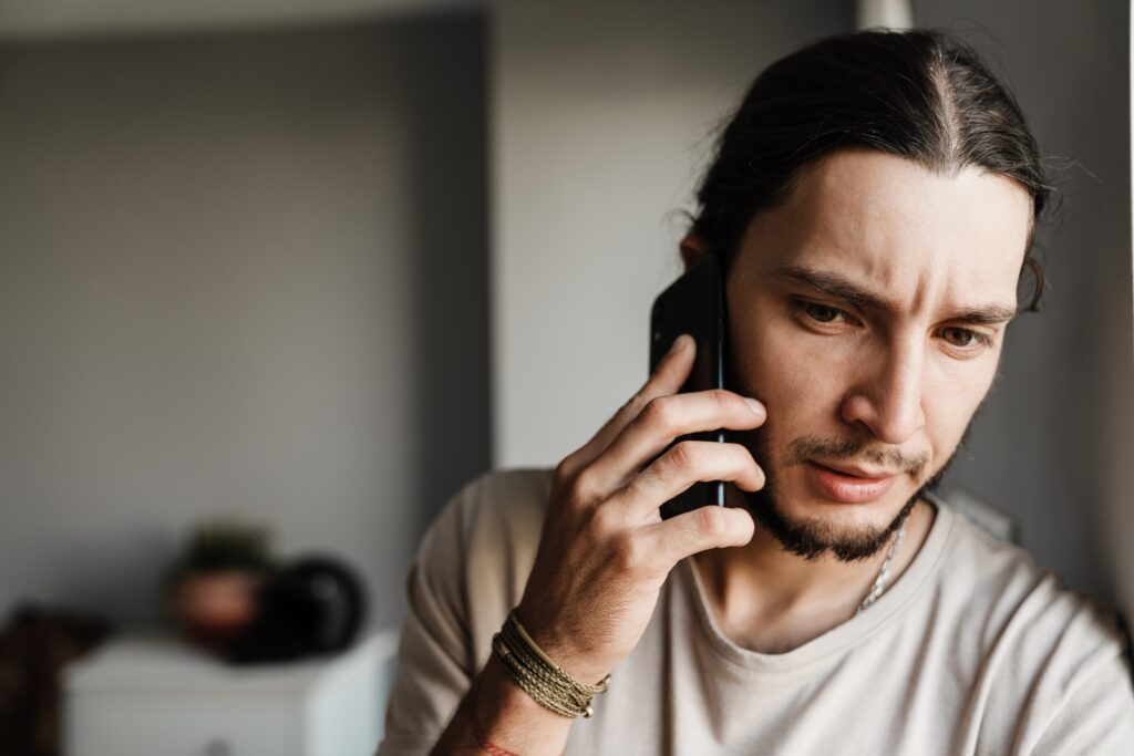 Concerned man on phone