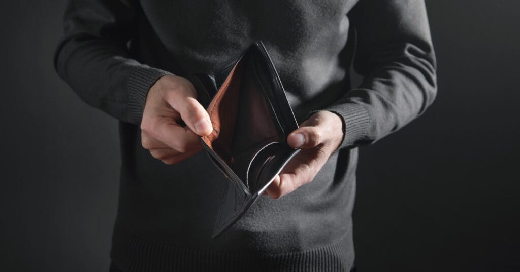 Man holding empty wallet