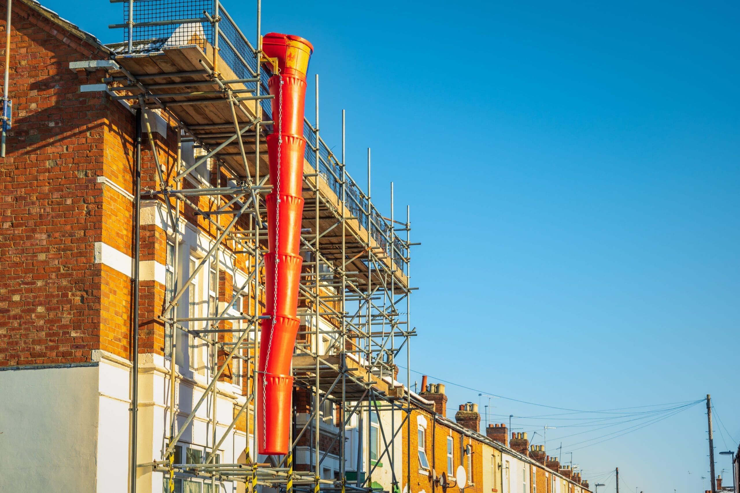 Building under construction with scaffolding in england uk