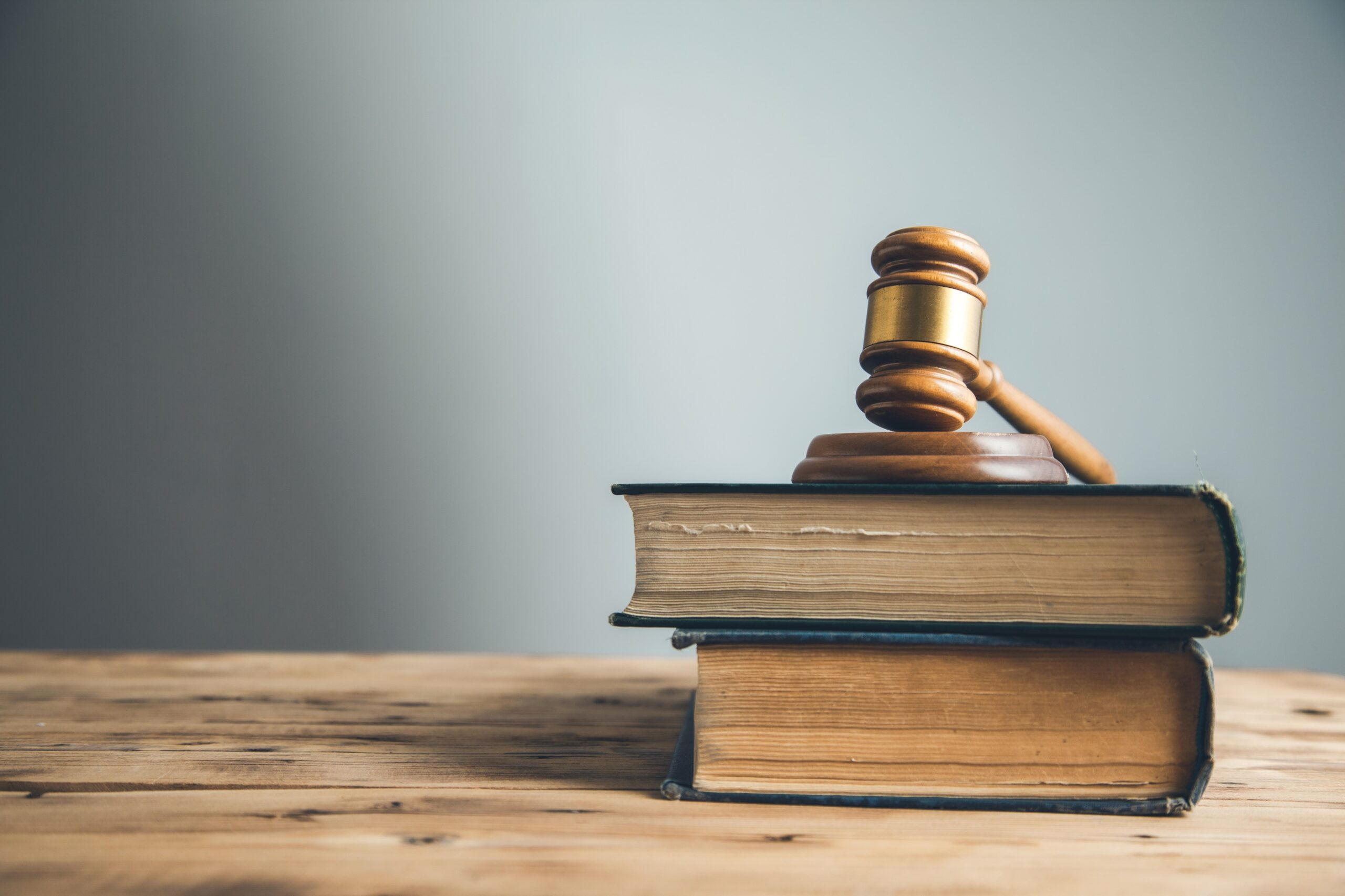 wooden gavel on book on the desk