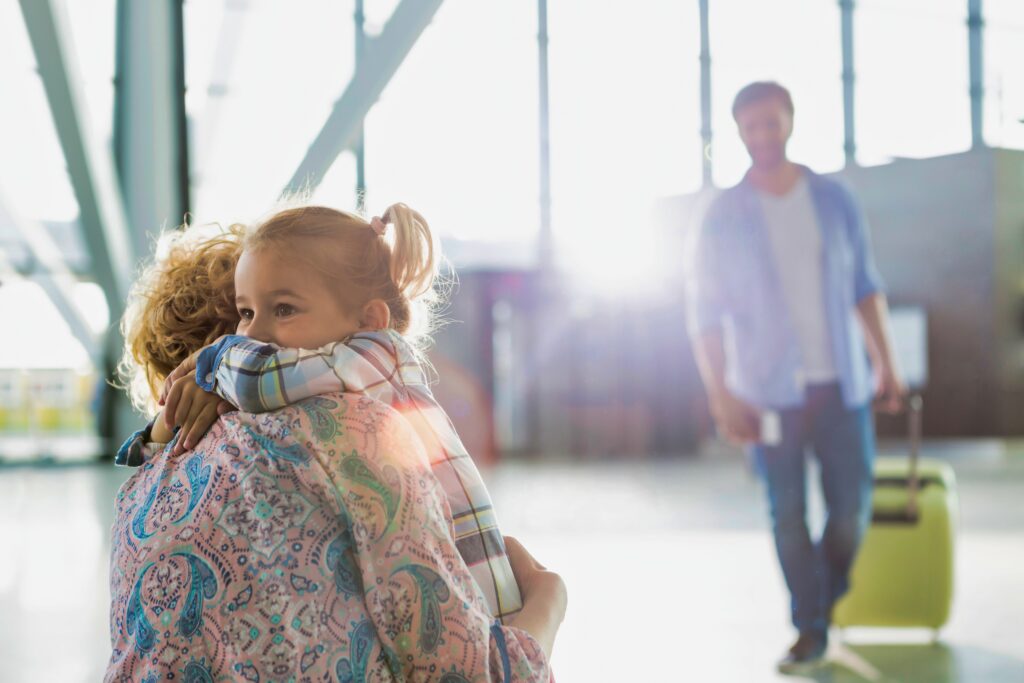 Portrait of woman reuniting with her daughter in airport - Lisa's Law Solicitors Portrait of woman reuniting with her daughter in airport
