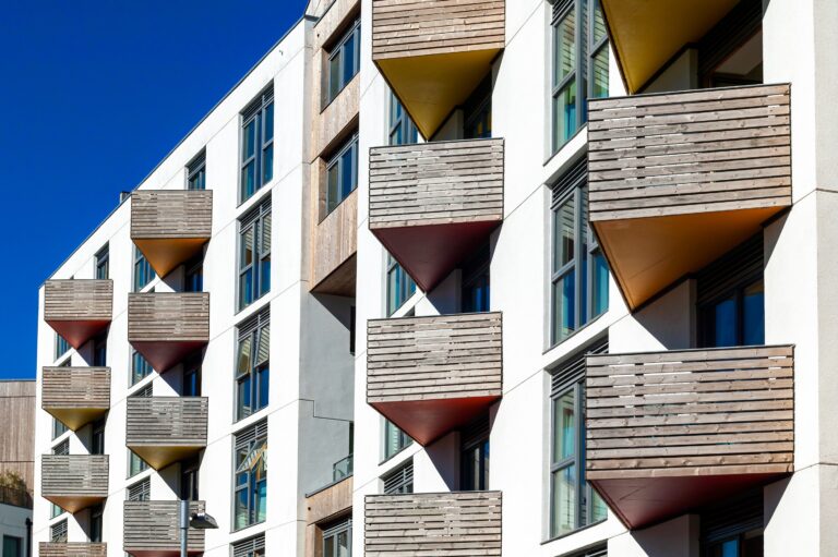 Modern new terraced houses and apartment flats with balconies in England UK