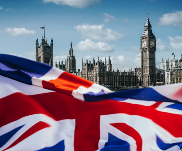 United Kingdom flag and Big Ben. London background.