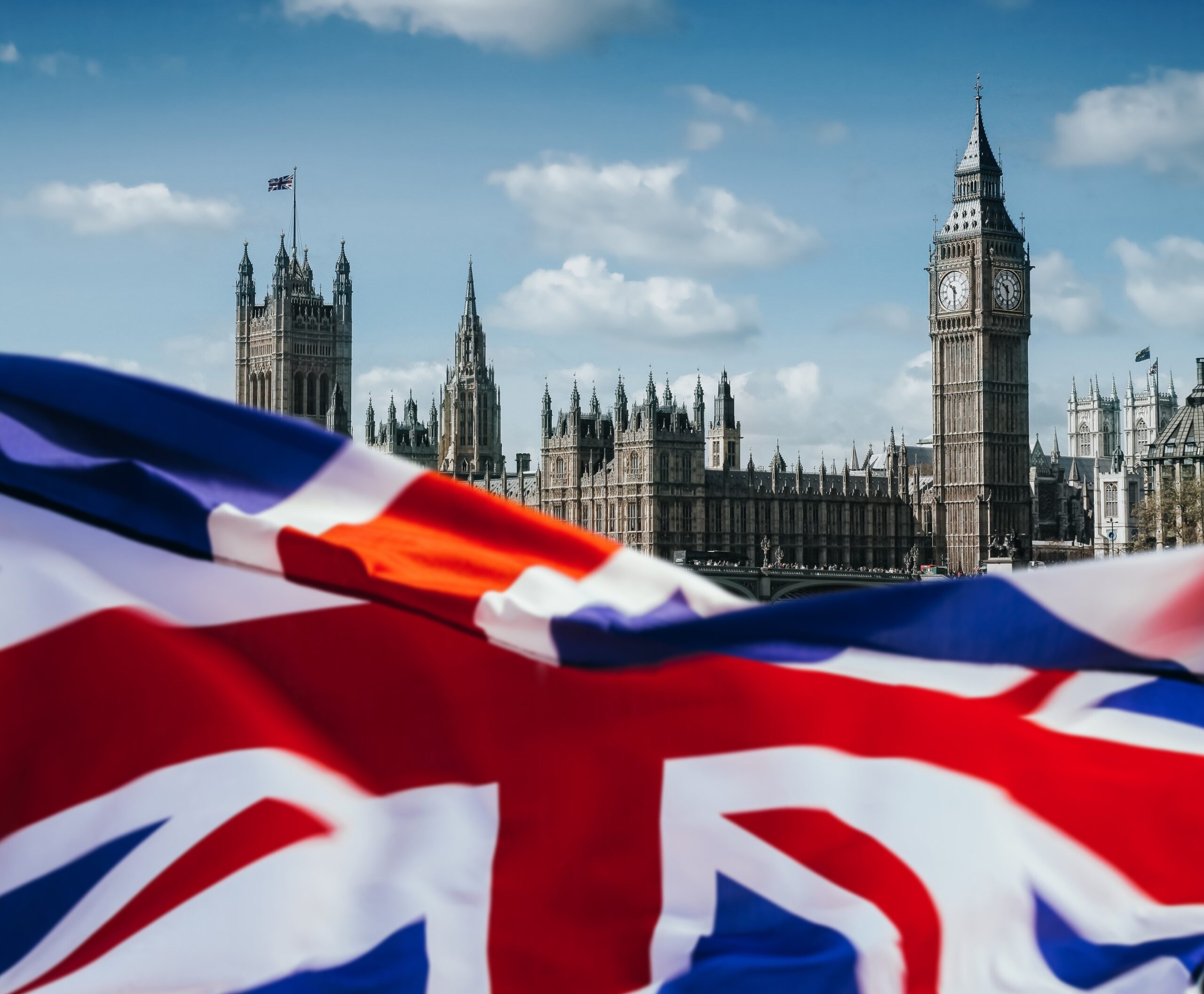 United Kingdom flag and Big Ben. London background.
