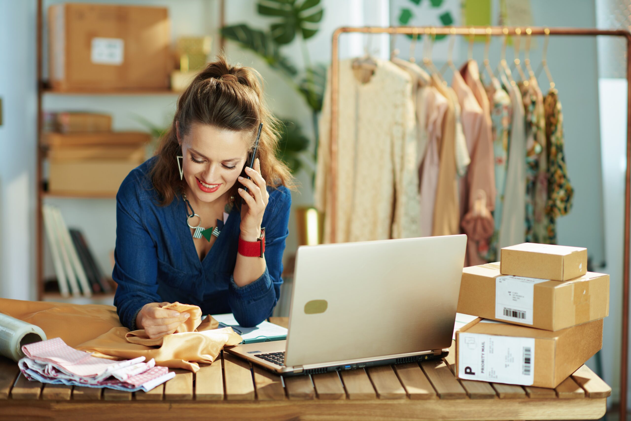 40 years old business owner woman in office talking on phone